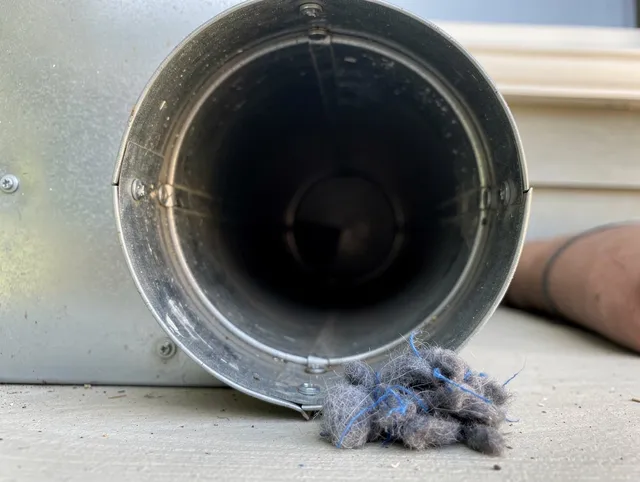 South Windsor Dryer Vent Cleaning technician using specialized equipment to clear severe dryer vent blockage in South Windsor